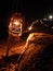 The old embankment is lit at night with a small lantern, The southern regions of Iran, which have been at war for years.