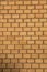 Old empty brick house factory wall with yellow bricks
