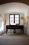 Old empty medieval room with piano