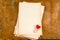 Old empty paper sheets and cloth pins with hearts top view wooden table mock up