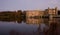 Old English Castle and lake at sunset