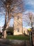 Old english church stone front tree west mersea