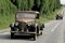 Old european car driving on a country road