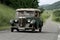 Old european car driving on a country road