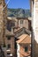 Old European City, the historic stone buildings and terracotta roofs of Kotor, with the ancient fortifications ascending the