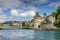 An old European city of Lucerne. Dam with waterfalls on a mountain lake.