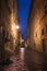 Old European city Pienza street at rainy night
