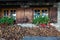 Old European wooden window with shutters and flower