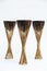 Old exotic tropical eastern wooden three coconut torches on white background
