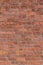 Old exterior European red brick wall background with English bond brickwork design