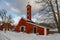 Old factory hose tower of red ochre painted wood