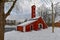 Old factory hose tower of red ochre painted wood