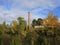 Old factory Schoenau and colorful trees in autumn