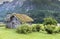 Old fairytale like house of wood with chimney of stacked slate