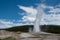 Old Faithful erupting in Yellowstone National Park Wyoming