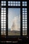 Old Faithful erupts, as seen from the Old Faithful Lodge windows