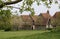 Old farm houses and barns in rural landscape