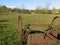 Old farm machinery left idle in the field