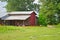 Old Farming Equipment, Tractor, and Red Barn