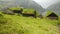 Old faroese house with grass rooftop in the middle of mist nature. Faroe Islands