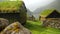 Old faroese house with grass rooftop in the middle of mist nature. Faroe Islands