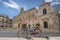 Old fashion bike with flower in front of Town hall Palazzo Municipale in the center of Ostuni, Apulia, Puglia, Italy