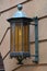 Old fashion lantern attached to sandstone wall