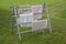 Old-fashioned authentic standing wooden laundry rack with clothes
