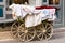 Old-fashioned baby carriage with wooden wheels
