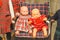 Old Fashioned Baby Dolls in Chair