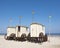 Old fashioned bathing carts used for changing on sunny beach of german island norderney