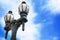 Old-fashioned black and gold streetlamps against blue sky