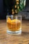 Old fashioned bourbon cocktail. Classic whiskey, whisky drink with sugar, bitters angostura and an orange zest garnish.