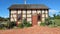 Old Fashioned Brick House with Brick Walkway