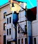 Old Fashioned Building With Tall Streetlamp and Fire Escape