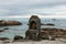 Old-fashioned fireplace made of bricks on ocean shore