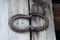 Old fashioned horse shoe hinges from a time long forgotten