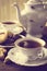 Old-fashioned image with two cups of tea vintage effect with cookies