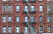Old fashioned New York apartment building with ornate window frames