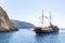 An old fashioned passenger ship is approaching one of the many beaches along the island of Zakynthos, Greece