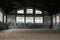 Old fashioned riding hall with sandy covering without people