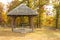 Old fashioned rustic wooden gazebo with a picnic table