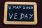Old fashioned school writing slate with 8 May 2020 VE Day