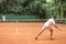 old-fashioned sportsmen playing tennis with wooden rackets