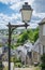 Old fashioned street lamp in front of terraced houses