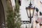 Old fashioned street lamp at night. Brightly lit street lamps at evening. Decorative lamps