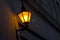Old fashioned street light on wall at night.Vintage lantern on
