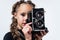 old fashioned tech. kid with vintage camera isolated on white.