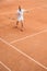 old-fashioned tennis player training with retro wooden racket