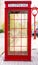 Old fashioned traditional red telephone booth or payphone